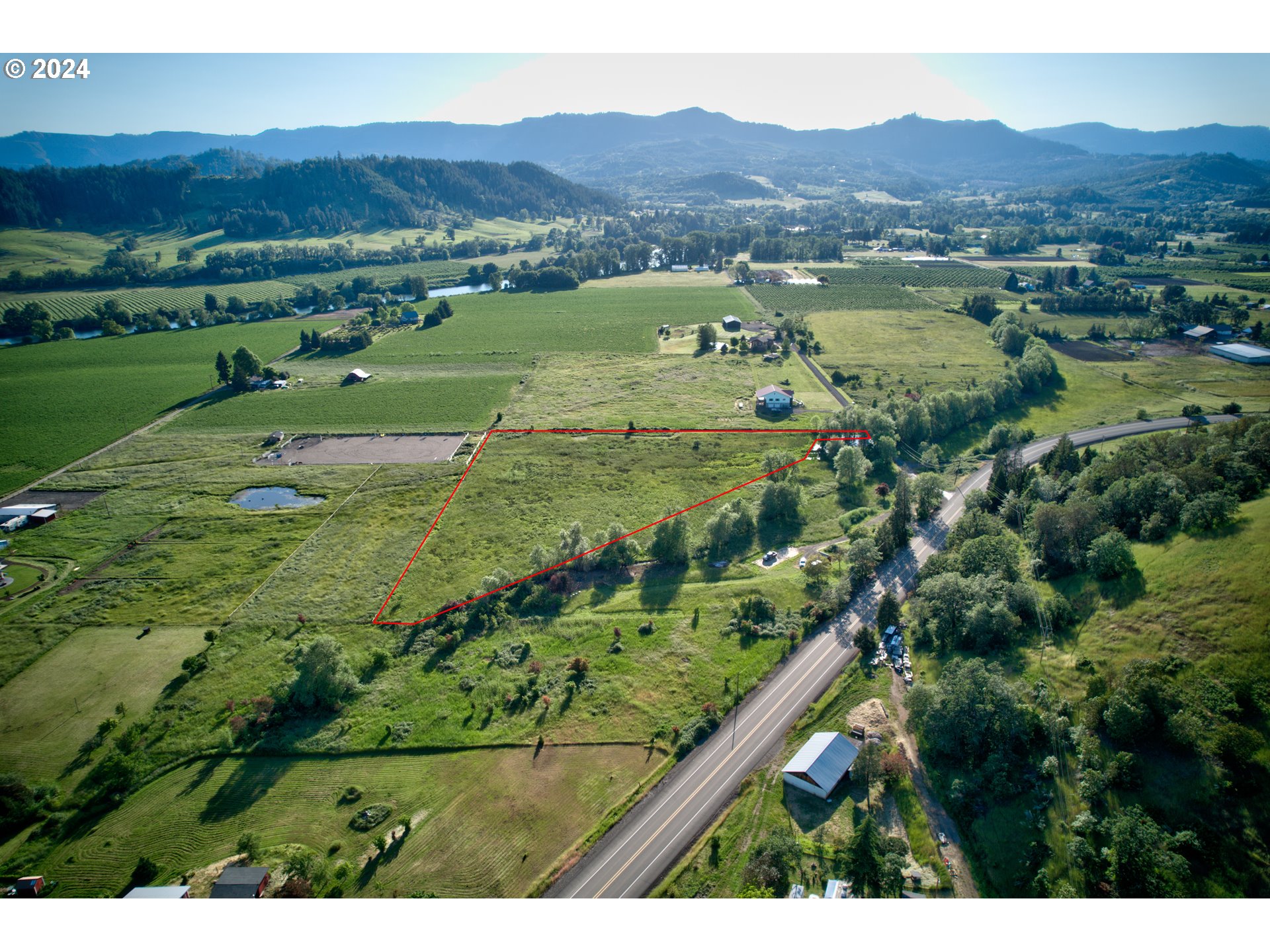 0 Healy Road, Unit 402 Roseburg, OR 97471 - Photo 12 of 24 a view of a lush green hillside and houses