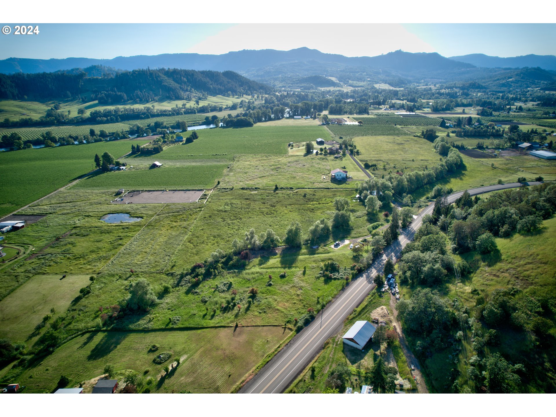0 Healy Road, Unit 402 Roseburg, OR 97471 - Photo 13 of 24 a view of a lush green hillside and houses