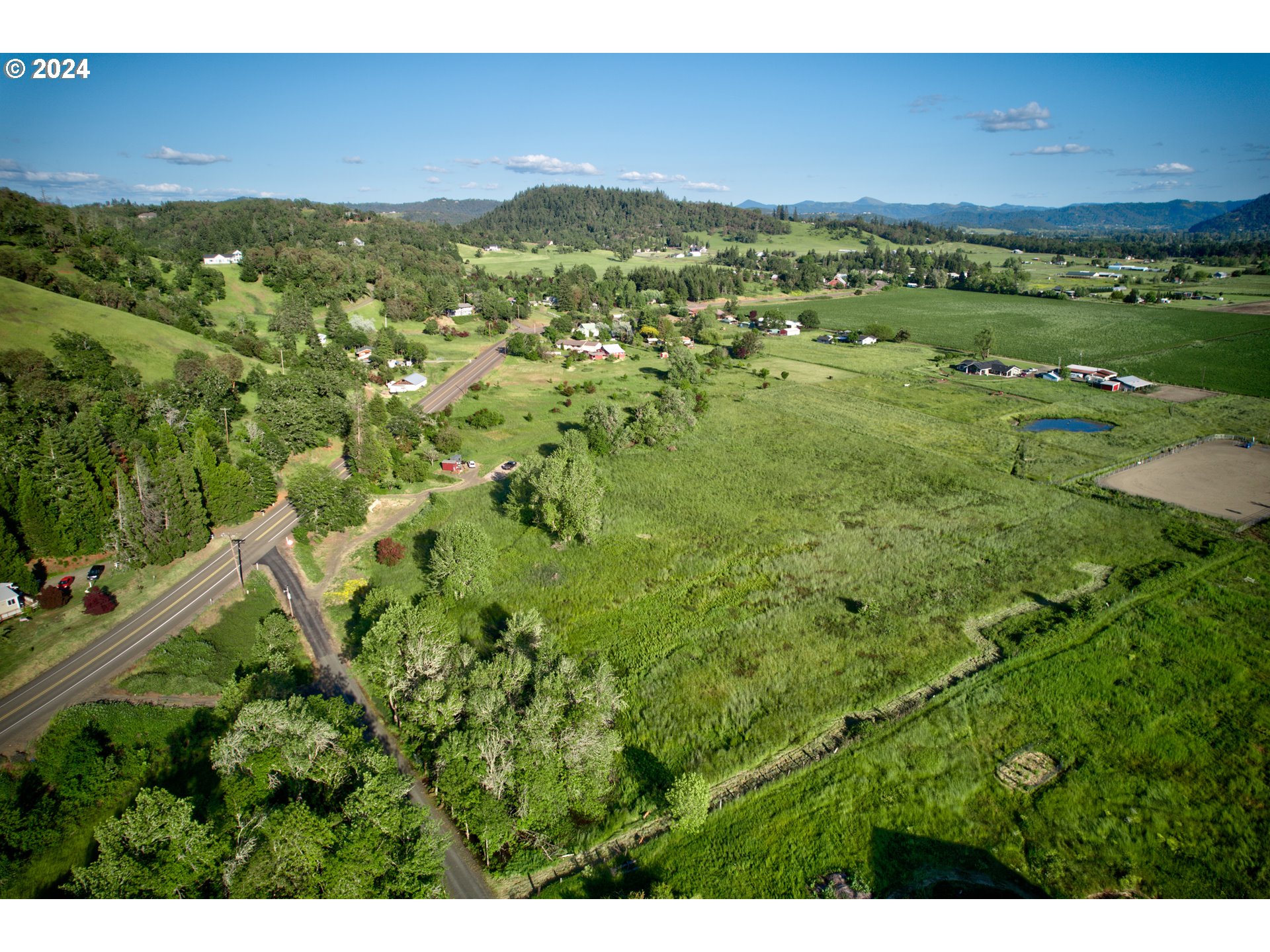 0 Healy Road, Unit 402 Roseburg, OR 97471 - Photo 2 of 24 a view of a green field with an ocean