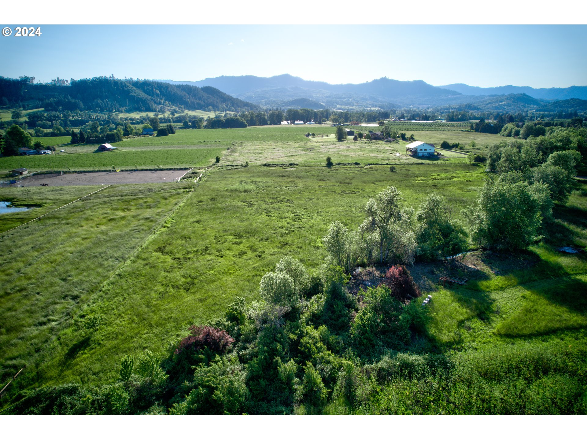 0 Healy Road, Unit 402 Roseburg, OR 97471 - Photo 4 of 24 a view of a lush green hillside and houses