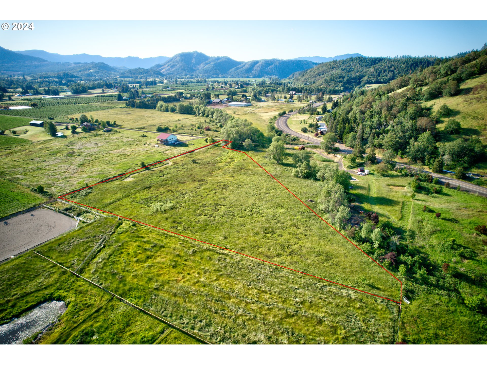 0 Healy Road, Unit 402 Roseburg, OR 97471 - Photo 5 of 24 a view of a lush green hillside and houses