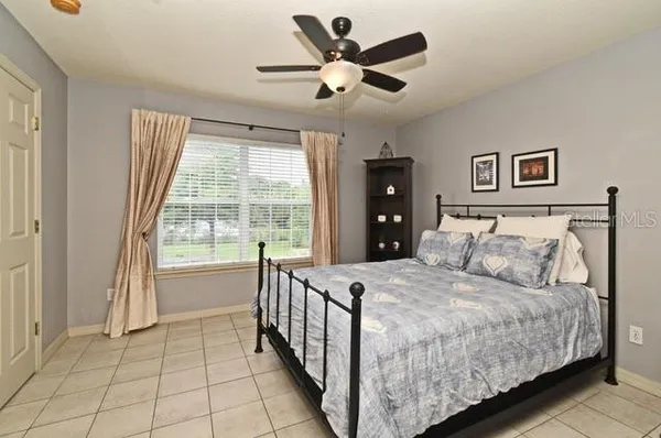 a bathroom with a sink a toilet and shower curtain