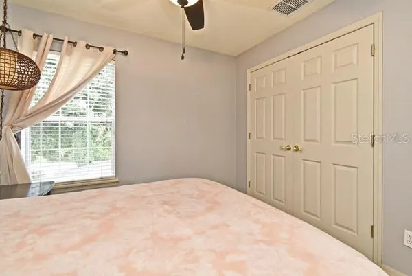a view of a livingroom with furniture and a ceiling fan