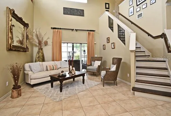 a view of livingroom with furniture and workspace