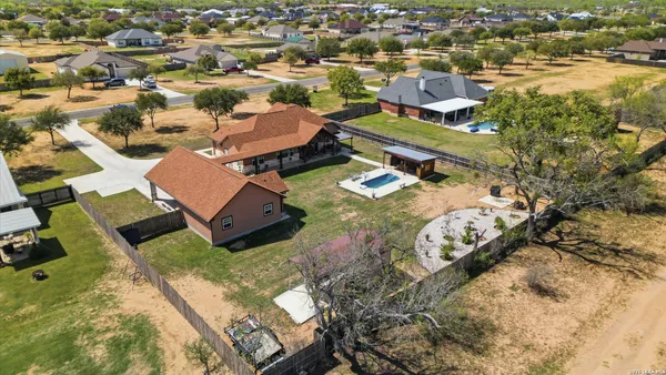 an aerial view of residential houses with outdoor space