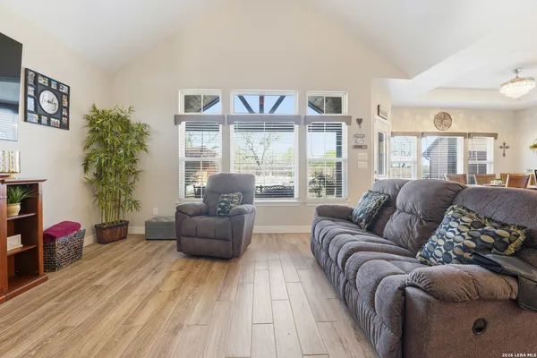 a living room with furniture and a large window