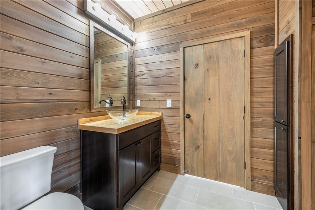1041 Astro Court Northeast Ranger, GA 30734 - Photo 29 of 52 a bathroom with a sink and mirror