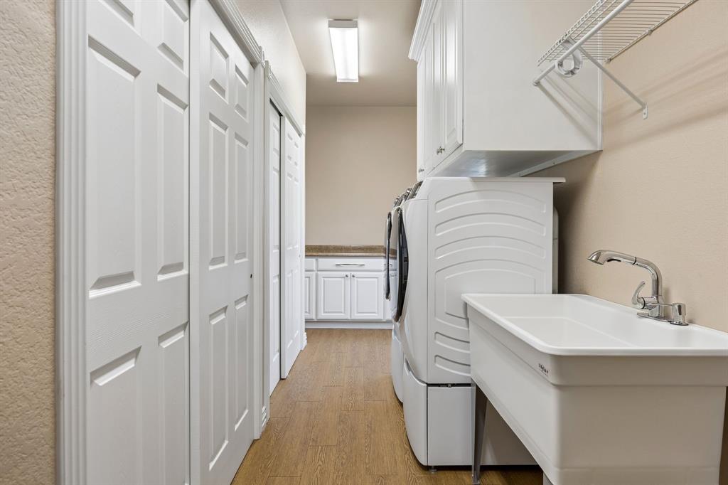174 King Ranch Court Fort Worth, TX 76108 - Photo 19 of 40 Primary Home - Laundry Room with plenty of storage and built ins along with sink