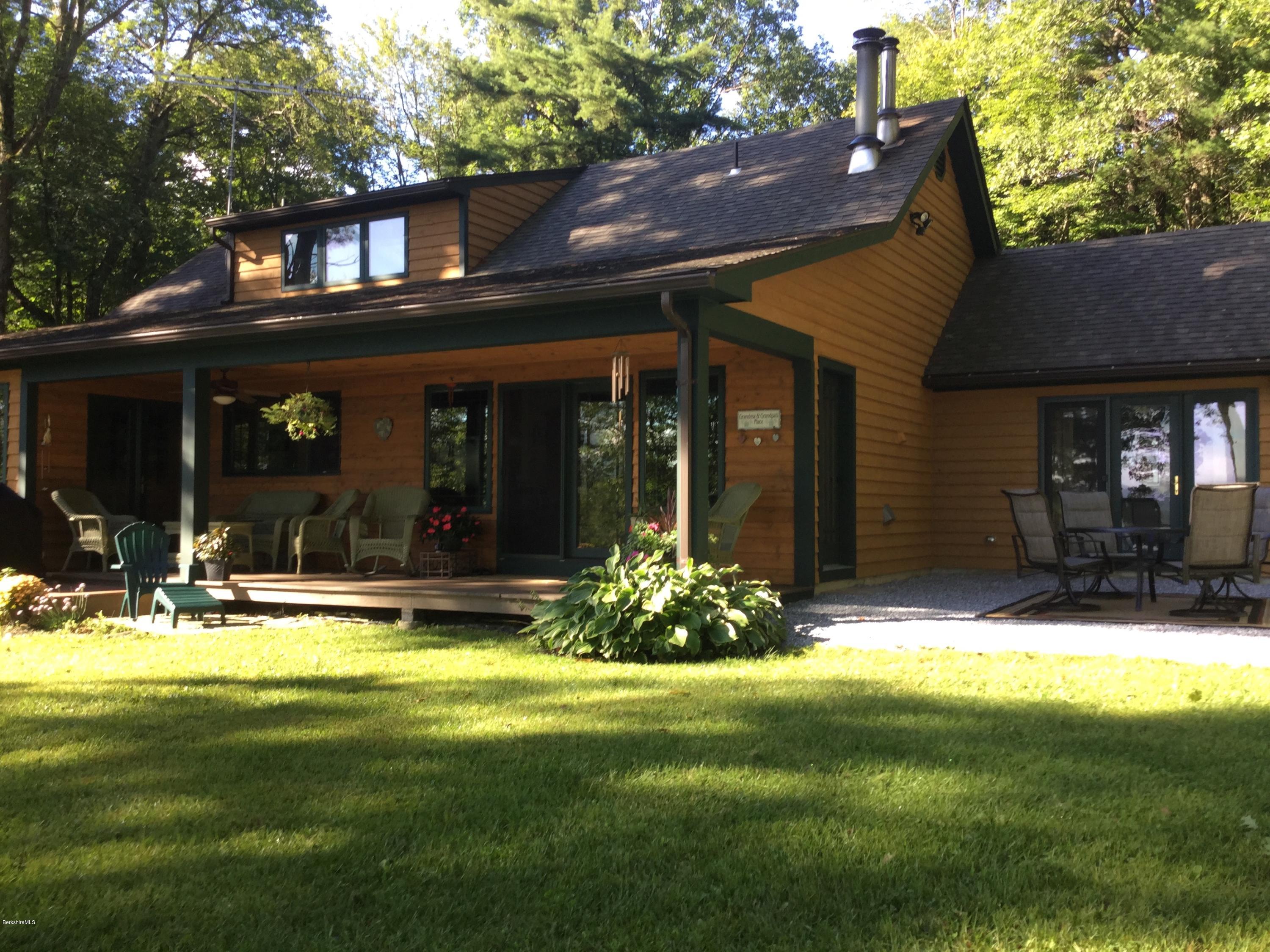 17A Goose Pond Road Tyringham, MA 01238 - Photo 1 of 29 a view of a house with swimming pool and porch with furniture
