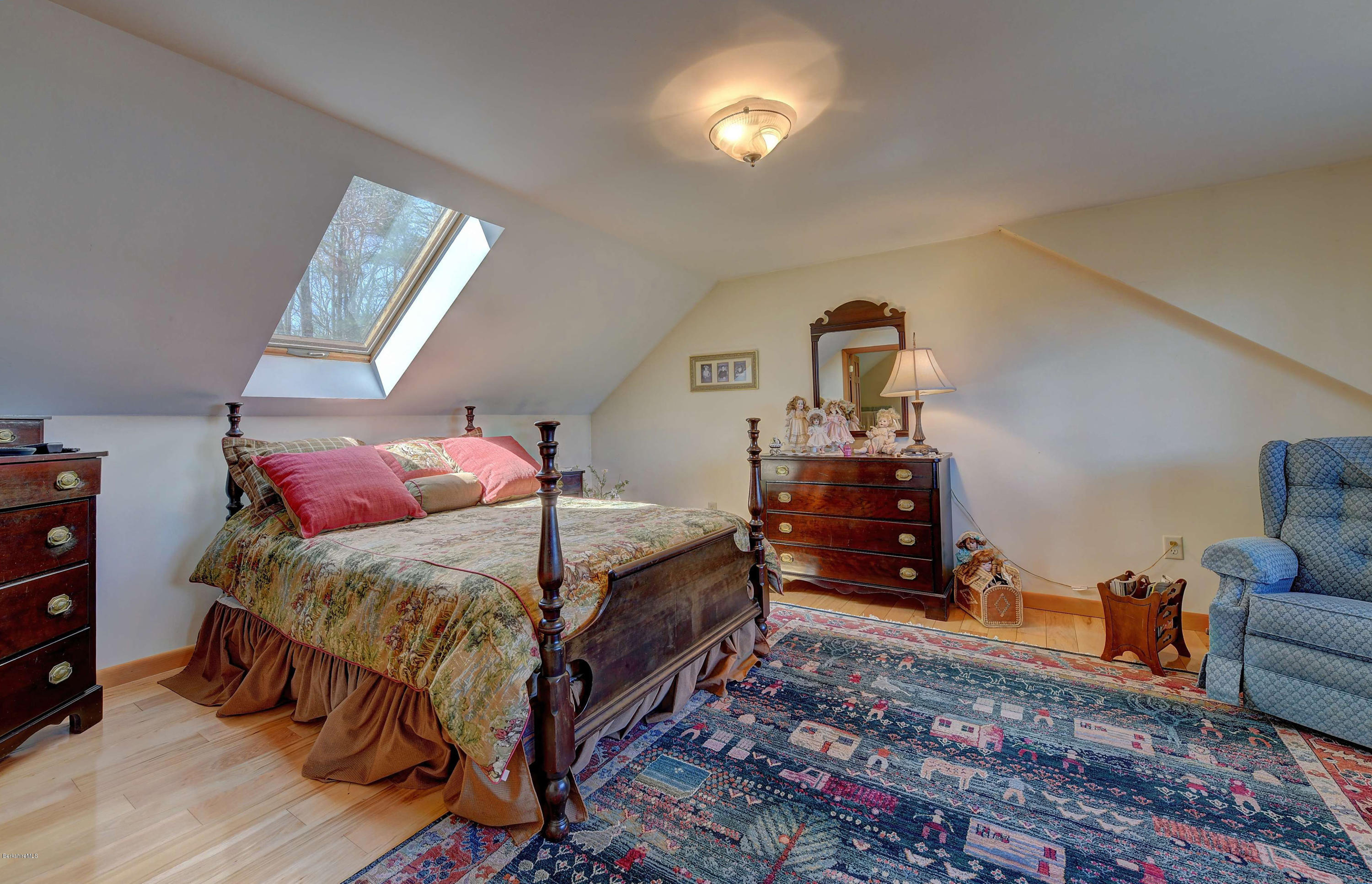 17A Goose Pond Road Tyringham, MA 01238 - Photo 11 of 29 a bedroom with a bed and wooden floor