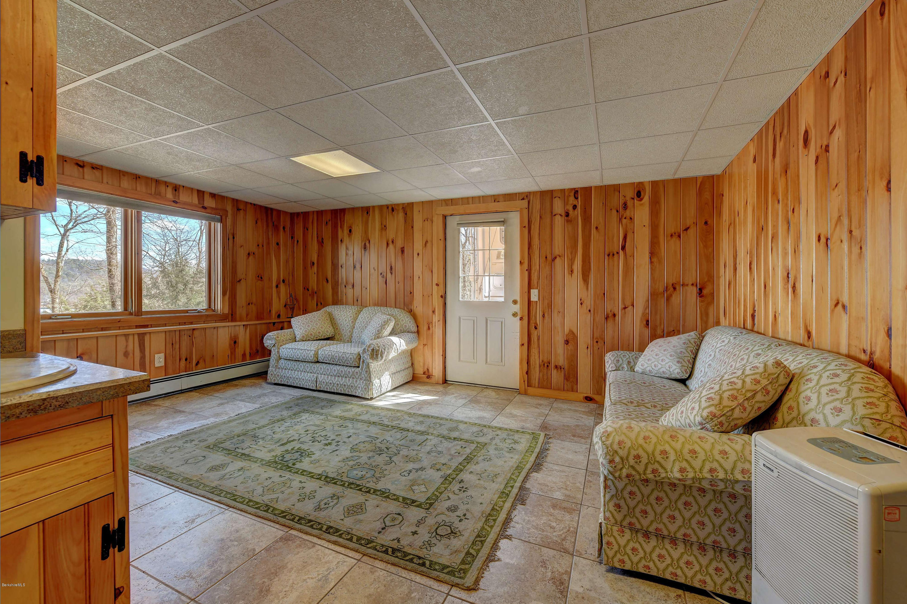 17A Goose Pond Road Tyringham, MA 01238 - Photo 13 of 29 a living room with furniture and a large window