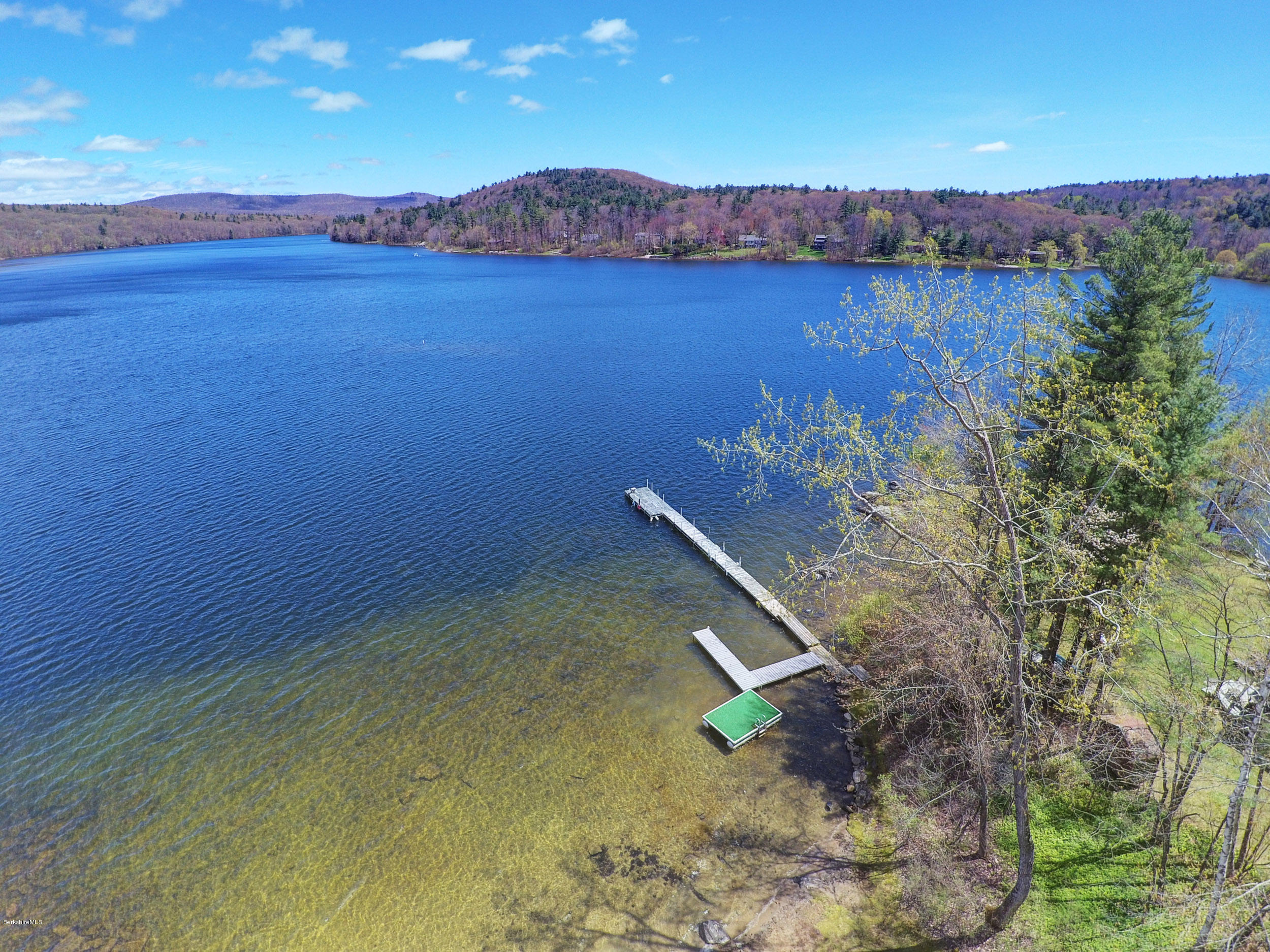 17A Goose Pond Road Tyringham, MA 01238 - Photo 15 of 29 a view of a lake with a mountain in the background