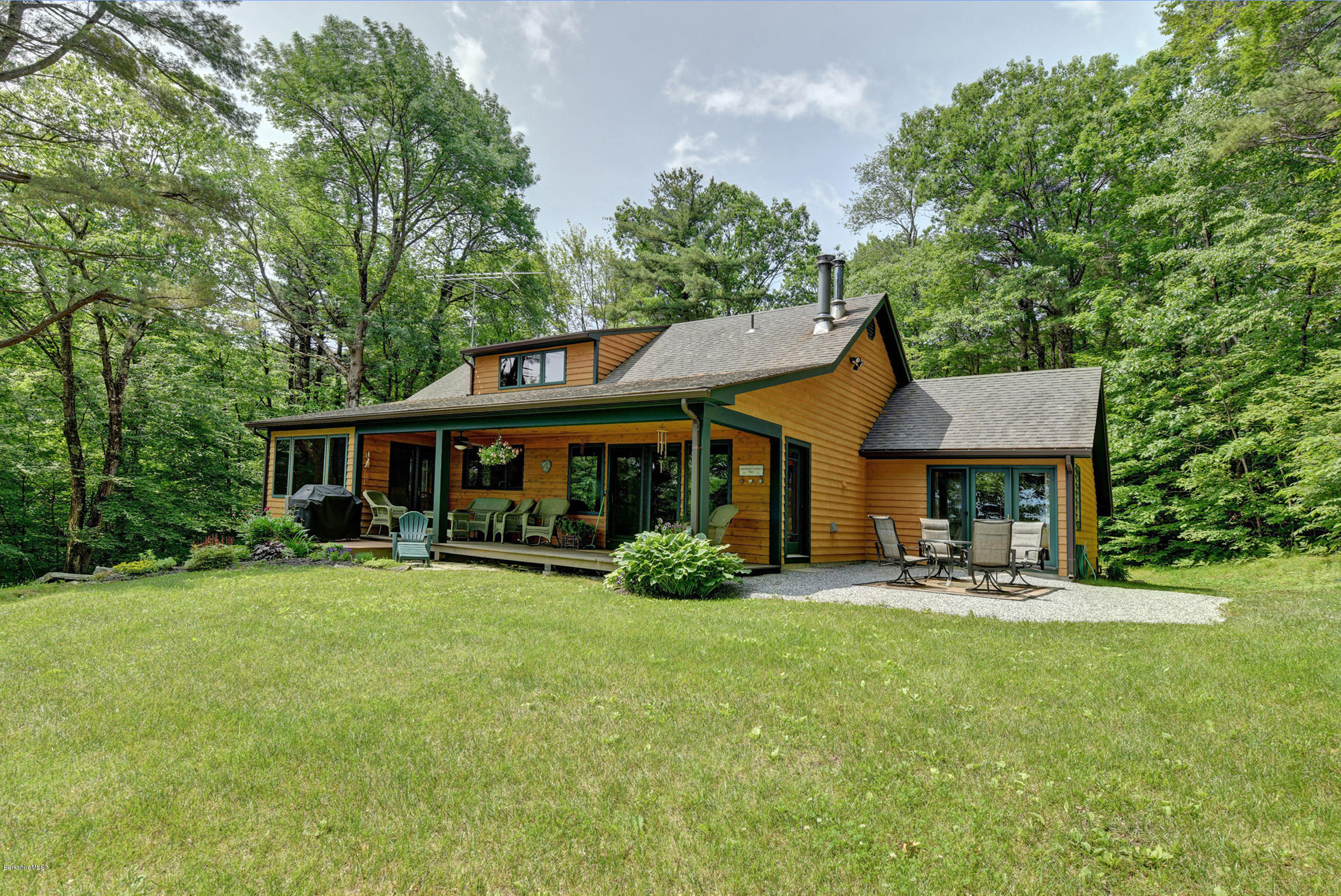 17A Goose Pond Road Tyringham, MA 01238 - Photo 17 of 29 a front view of a house with garden and porch