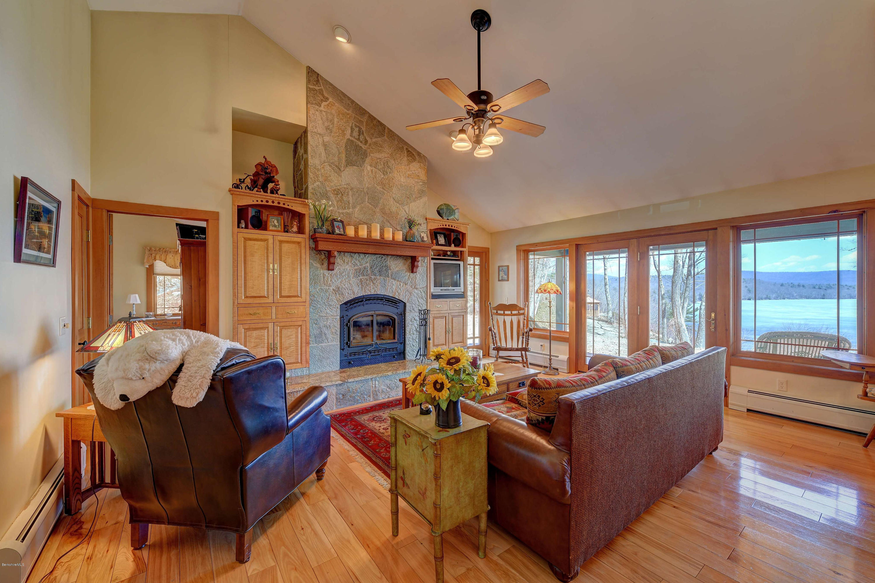17A Goose Pond Road Tyringham, MA 01238 - Photo 3 of 29 a living room with furniture and a fireplace