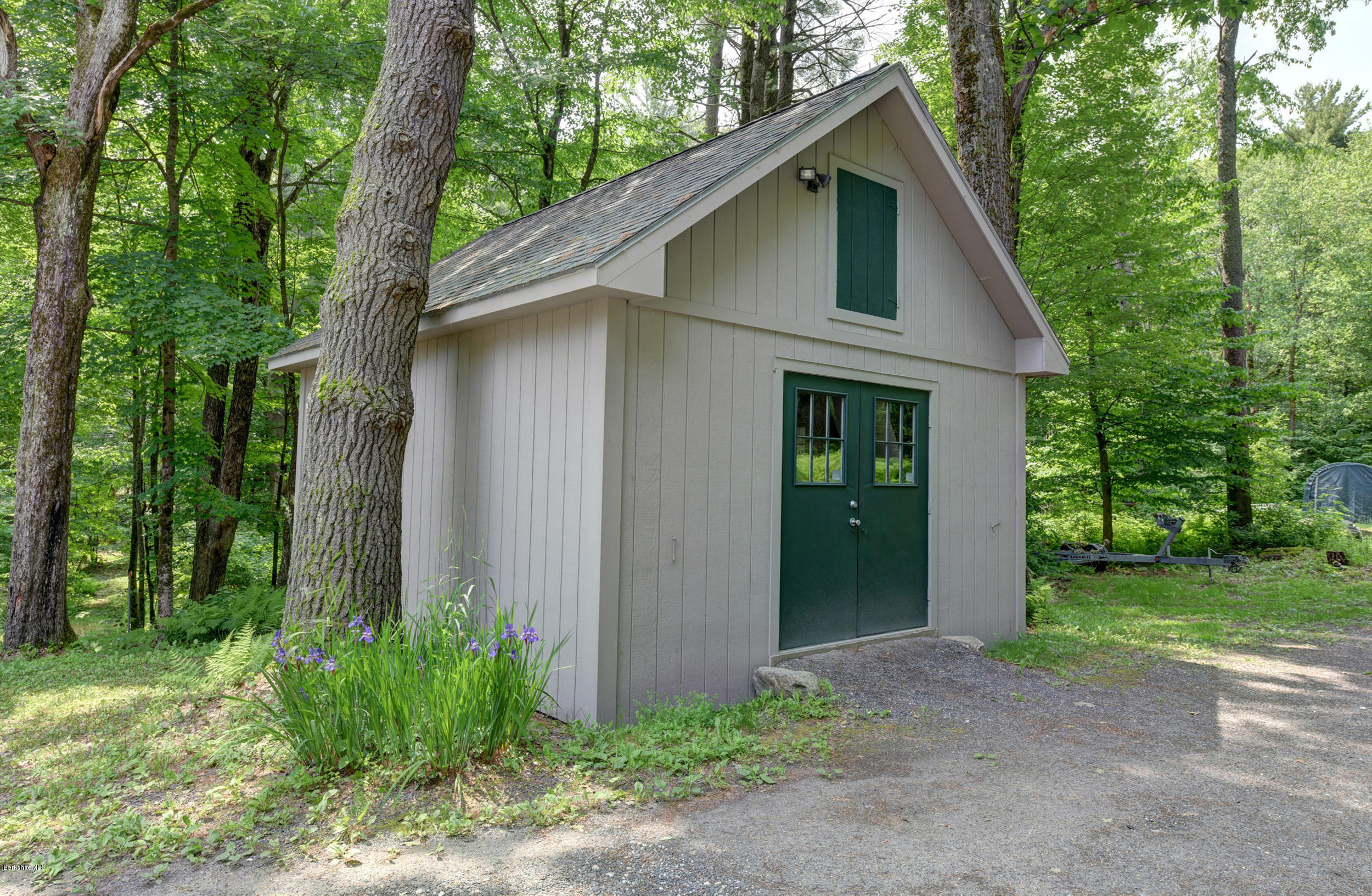 17A Goose Pond Road Tyringham, MA 01238 - Photo 26 of 29 a front view of a house with garden