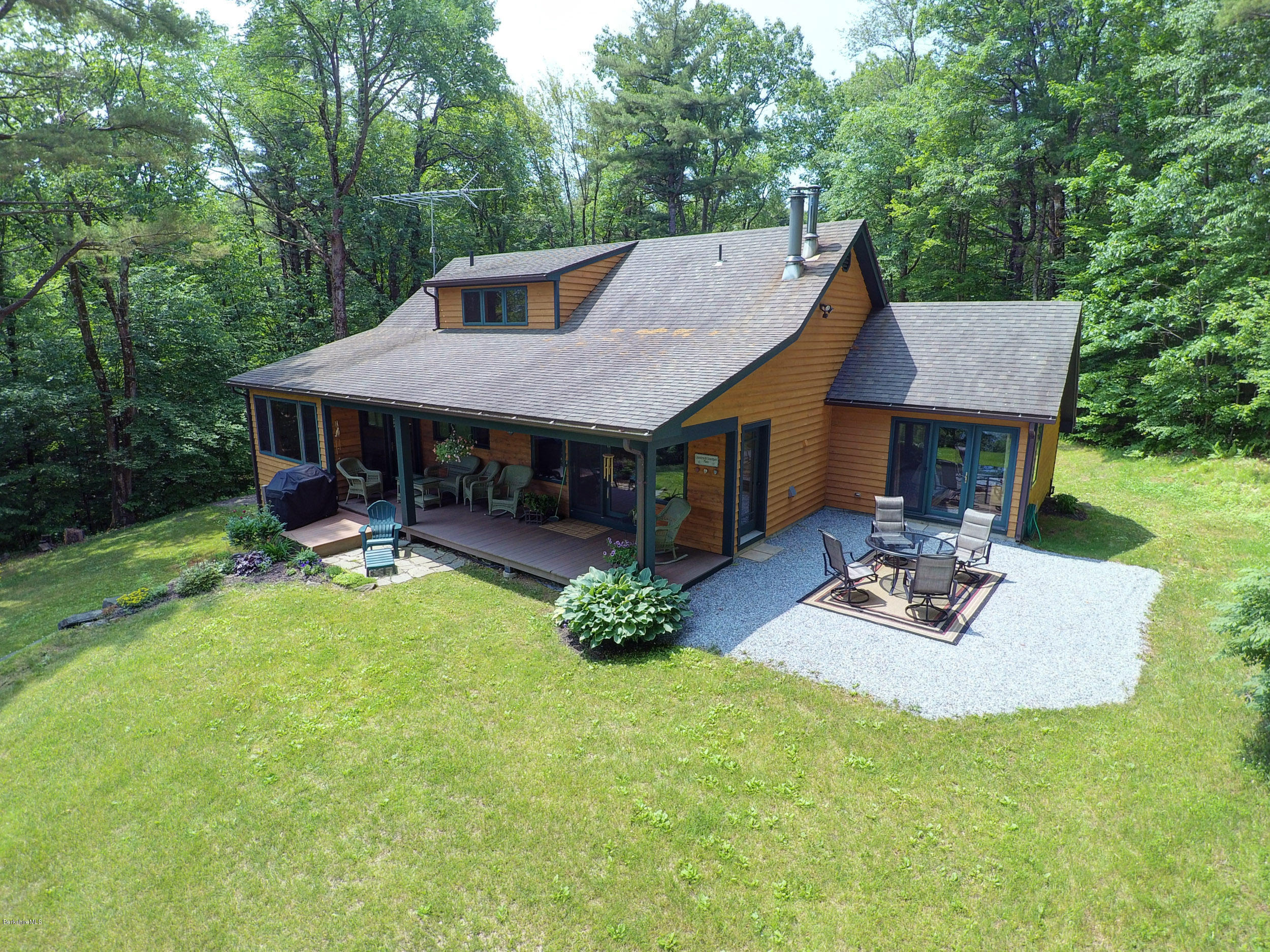 17A Goose Pond Road Tyringham, MA 01238 - Photo 28 of 29 a view of house with backyard and outdoor seating