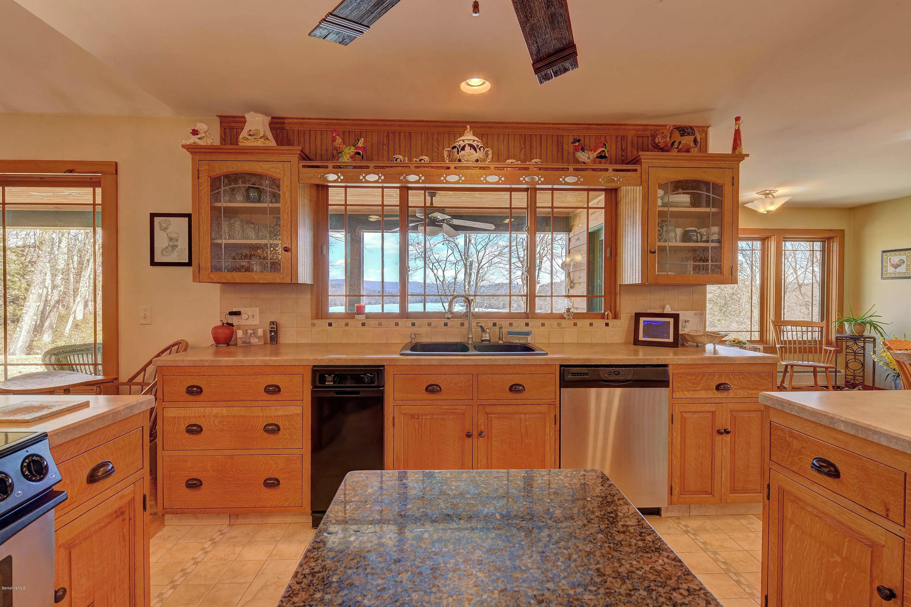 17A Goose Pond Road Tyringham, MA 01238 - Photo 5 of 29 a large kitchen with stainless steel appliances granite countertop a sink and cabinets