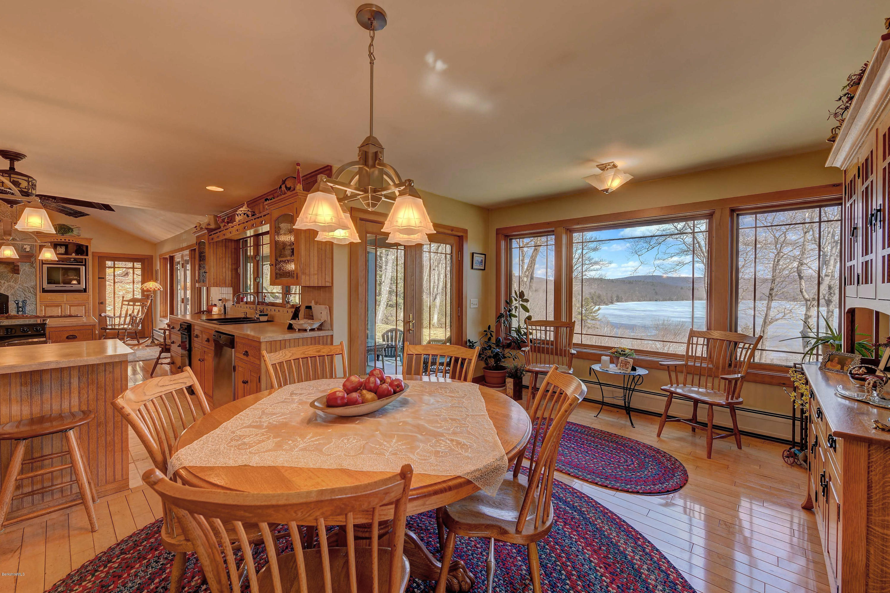 17A Goose Pond Road Tyringham, MA 01238 - Photo 7 of 29 a view of a dining room with furniture large windows and wooden floor