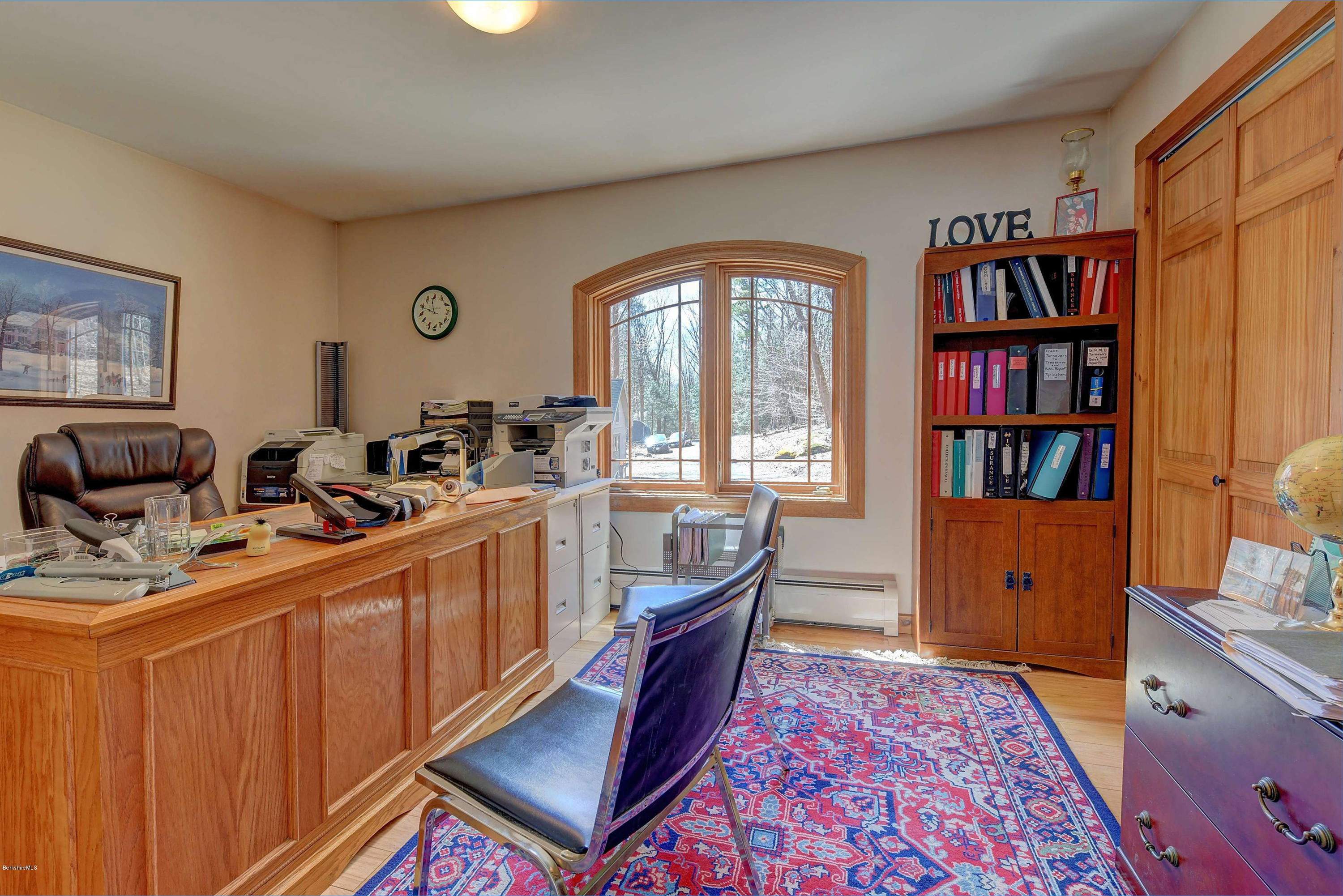 17A Goose Pond Road Tyringham, MA 01238 - Photo 10 of 29 a room with furniture a bookshelf and a window