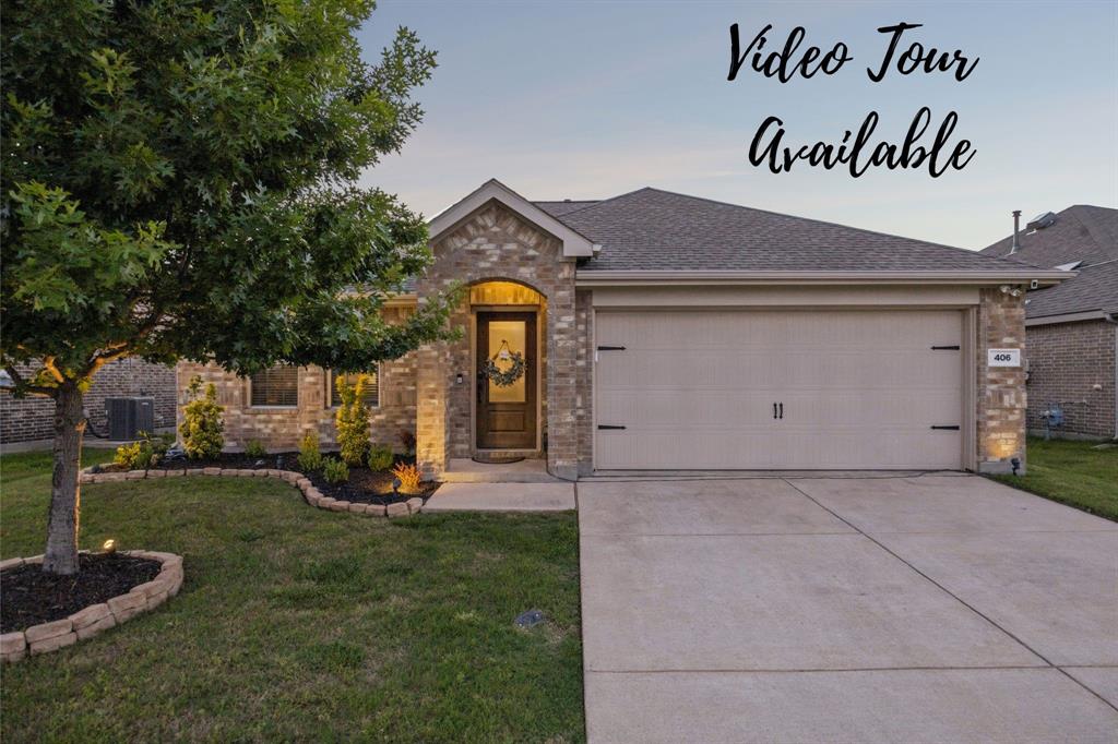 406 Madrone Lane Princeton, TX 75407 - Photo 2 of 30 Brick-front exterior featuring an arched entryway with a glass-paneled door
