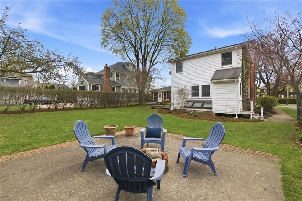 238 Harris Avenue Needham, MA 02492 - Photo 31 of 35 a patio table and chairs with the garden view