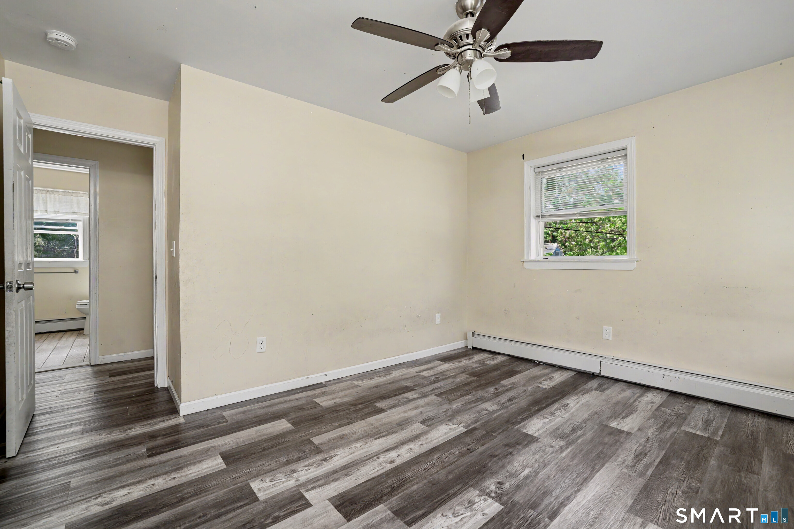 97 Boothbay Street Bloomfield, CT 06002 - Photo 28 of 33 wooden floor in an empty room with a window