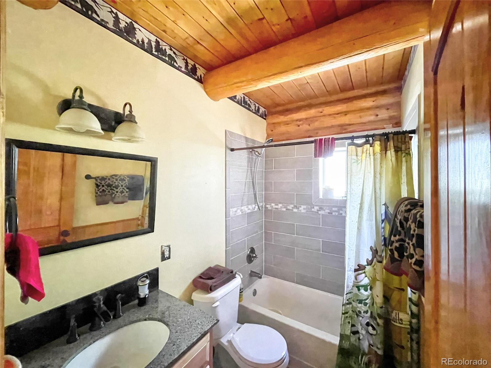 43 Pintail Road Como, CO 80432 - Photo 12 of 34 a bathroom with a granite countertop sink toilet and shower