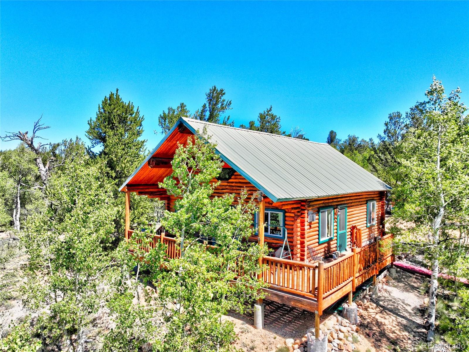 43 Pintail Road Como, CO 80432 - Photo 18 of 34 an outdoor sitting area with a table and chairs
