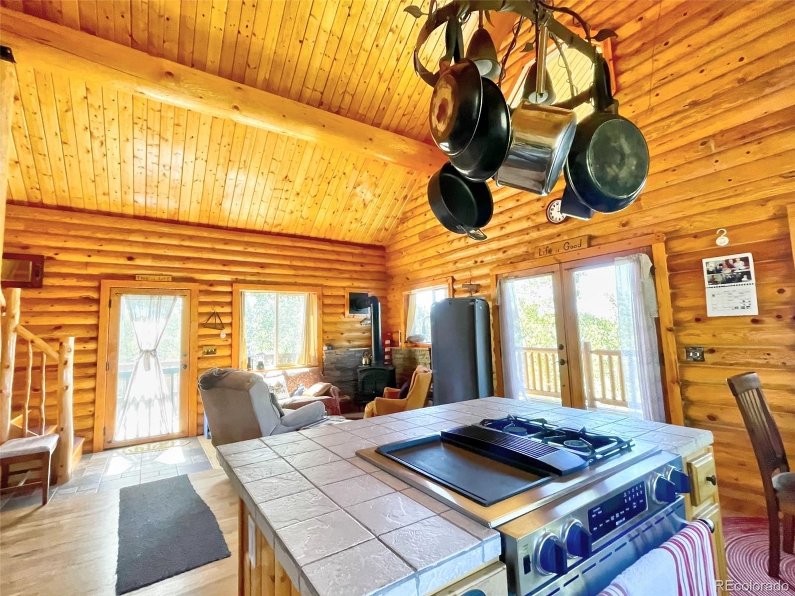 43 Pintail Road Como, CO 80432 - Photo 7 of 34 a view of a dinning room with furniture and a chandelier