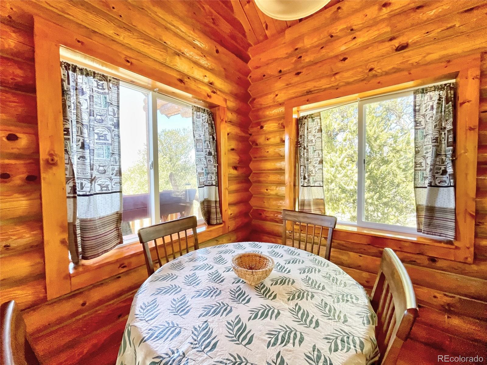 43 Pintail Road Como, CO 80432 - Photo 8 of 34 a bed sitting in a bedroom next to a large window