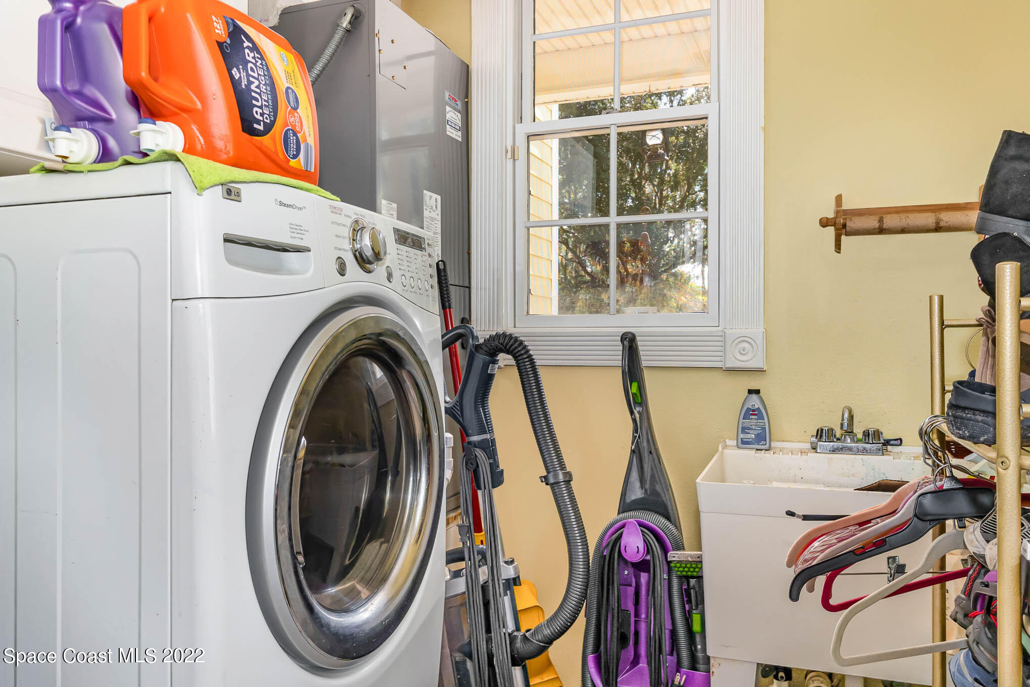 3440 Carter Road Mims, FL 32754 - Photo 18 of 36 a utility room with dryer and washer
