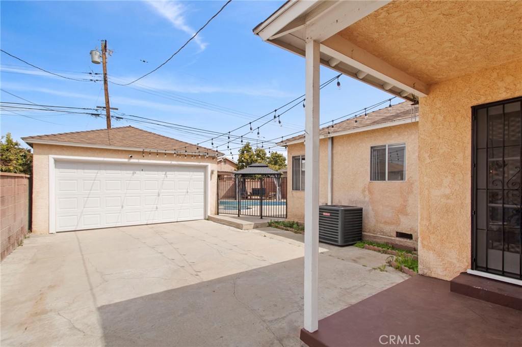 11339 Cecilia Street Downey, CA 90241 - Photo 16 of 17 a front view of a house with a garage