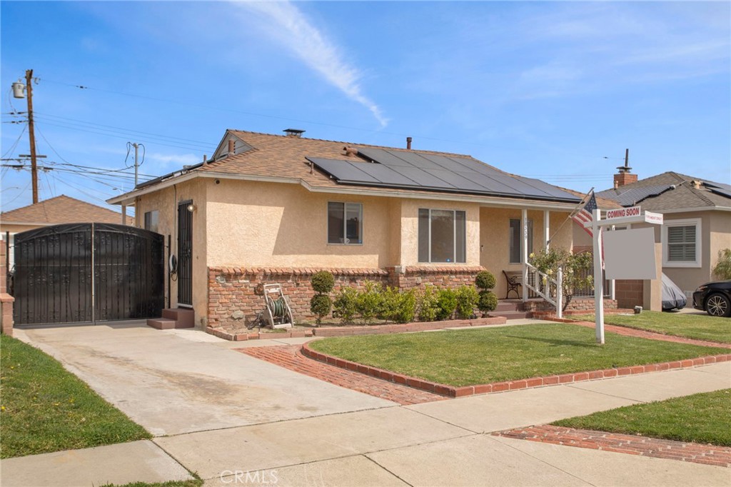 11339 Cecilia Street Downey, CA 90241 - Photo 2 of 17 a view of a white house with a yard
