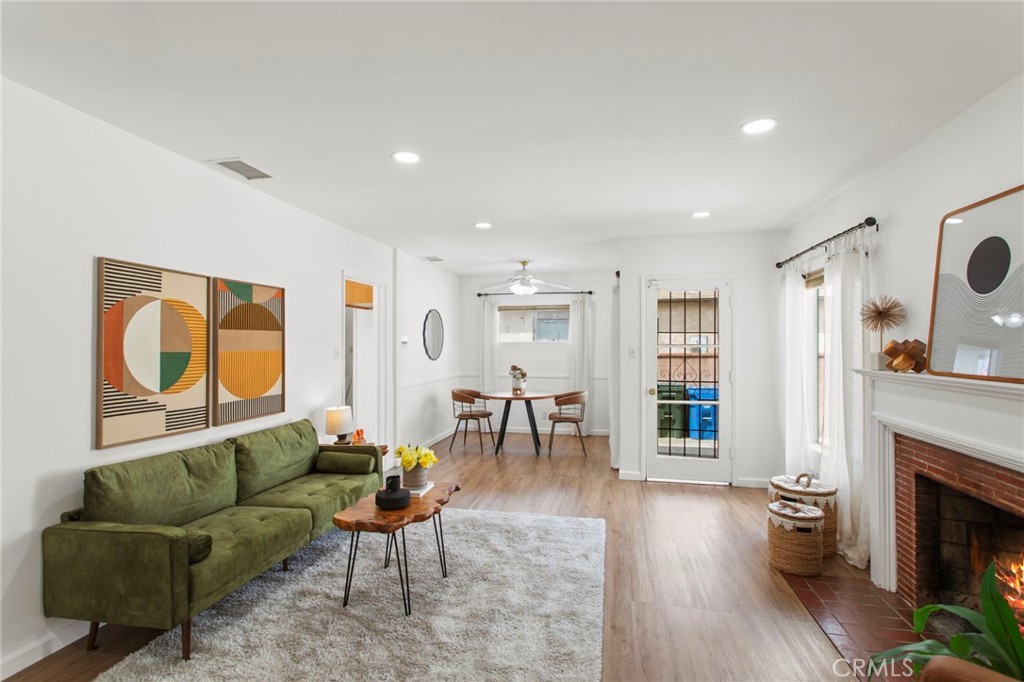 11339 Cecilia Street Downey, CA 90241 - Photo 4 of 17 a living room with furniture and a fireplace