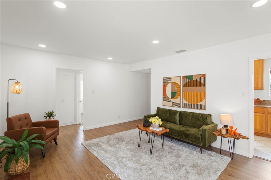 11339 Cecilia Street Downey, CA 90241 - Photo 5 of 17 a living room with furniture and wooden floor
