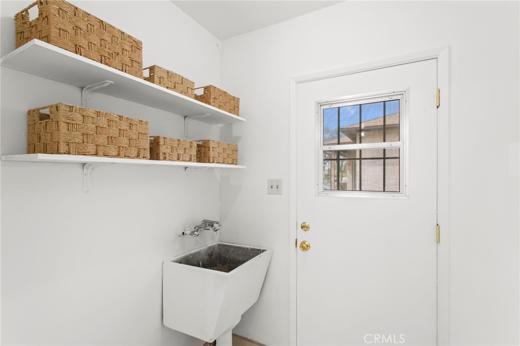 11339 Cecilia Street Downey, CA 90241 - Photo 9 of 17 a bathroom with a sink and mirror