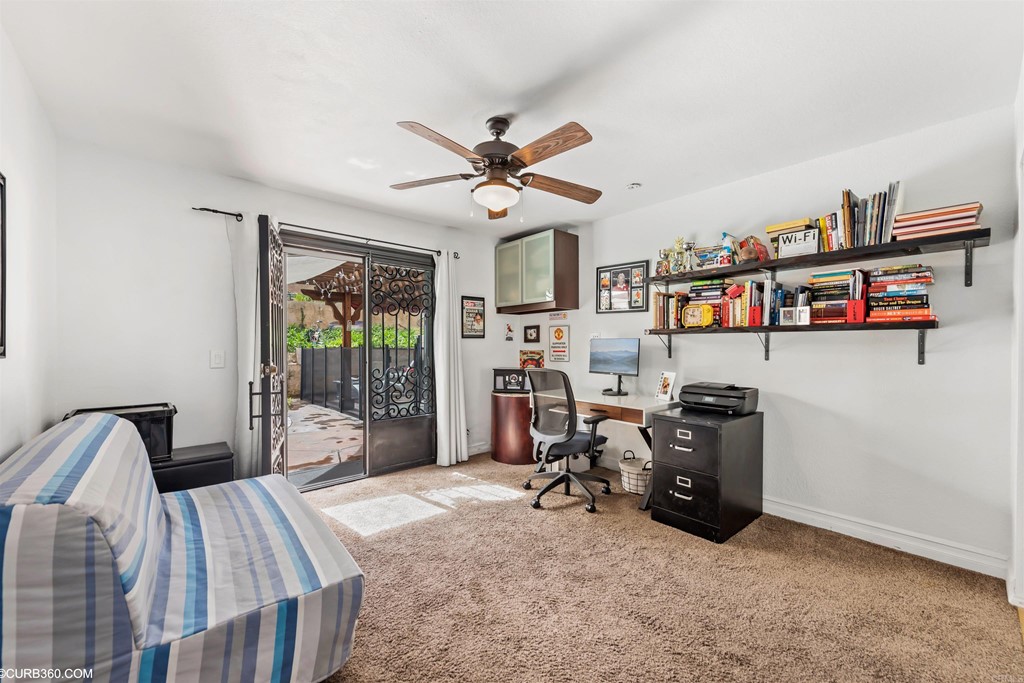 1179 Patricia Circle Vista, CA 92084 - Photo 18 of 48 a bed room with furniture and a book shelf
