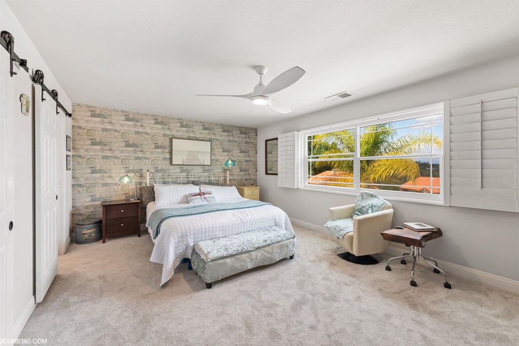1179 Patricia Circle Vista, CA 92084 - Photo 25 of 48 a bedroom with a bed and window