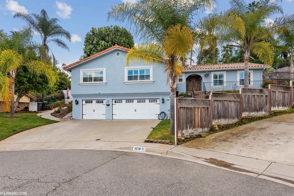 1179 Patricia Circle Vista, CA 92084 - Photo 48 of 48 a view of a house with a yard and palm trees