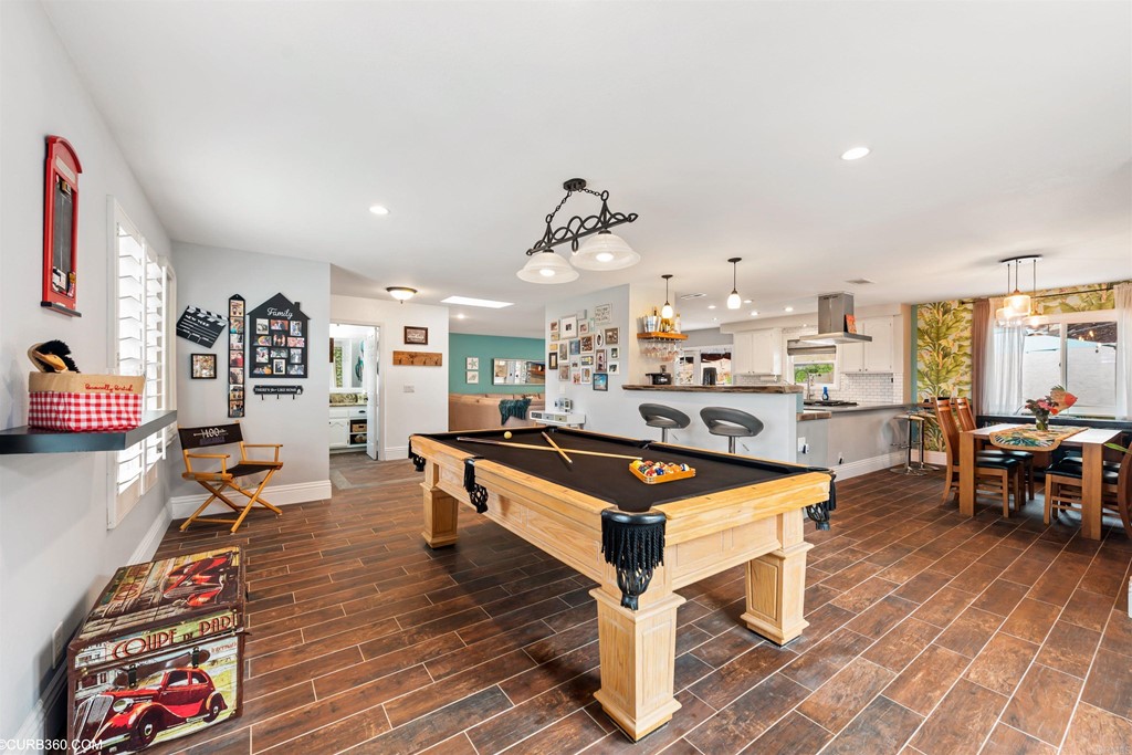 1179 Patricia Circle Vista, CA 92084 - Photo 6 of 48 a living room with furniture a table and kitchen view