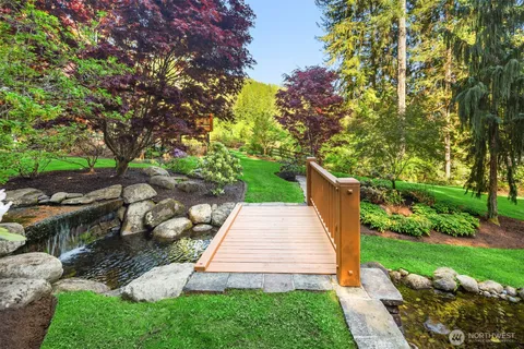 a view of a backyard with plants and a patio