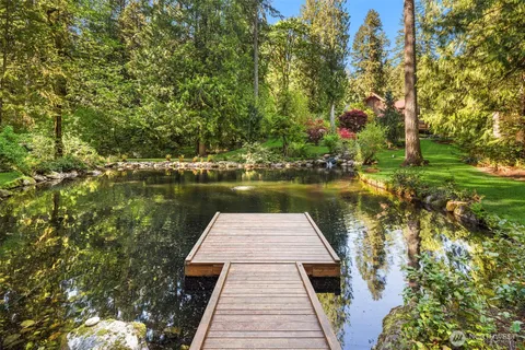swimming pool view with a lake view