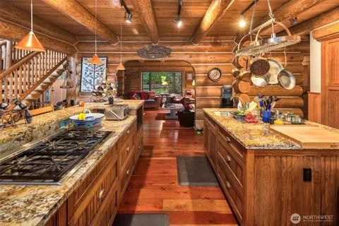 a view of an entryway with wooden floor and seating