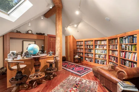 a bathroom with a sink mirror and toilet