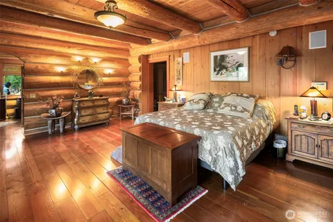 a bath tub sitting in a bathroom next to a window