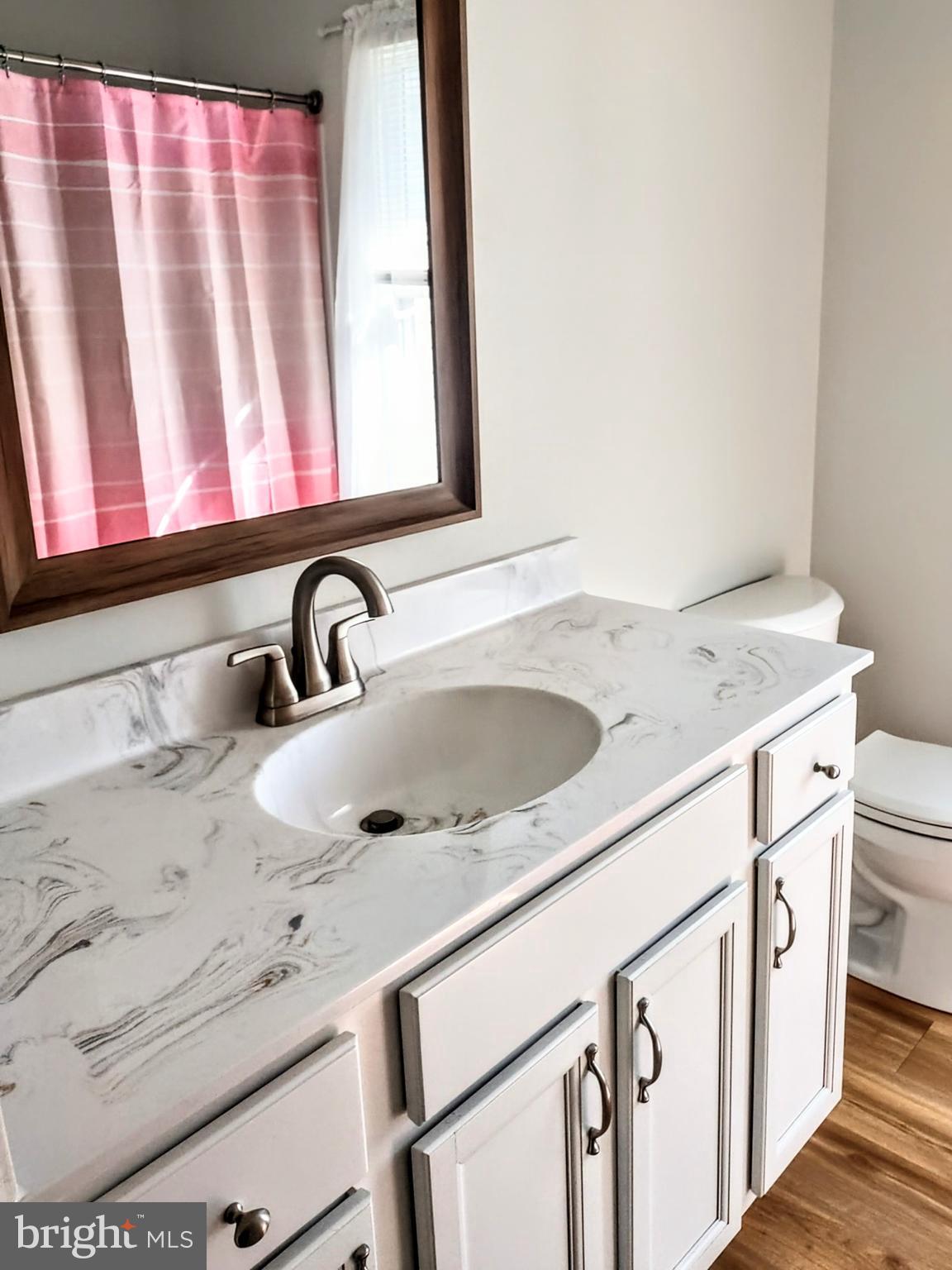 645 West 1st Street Boiling Springs, PA 17007 - Photo 11 of 23 a bathroom with a sink and a mirror