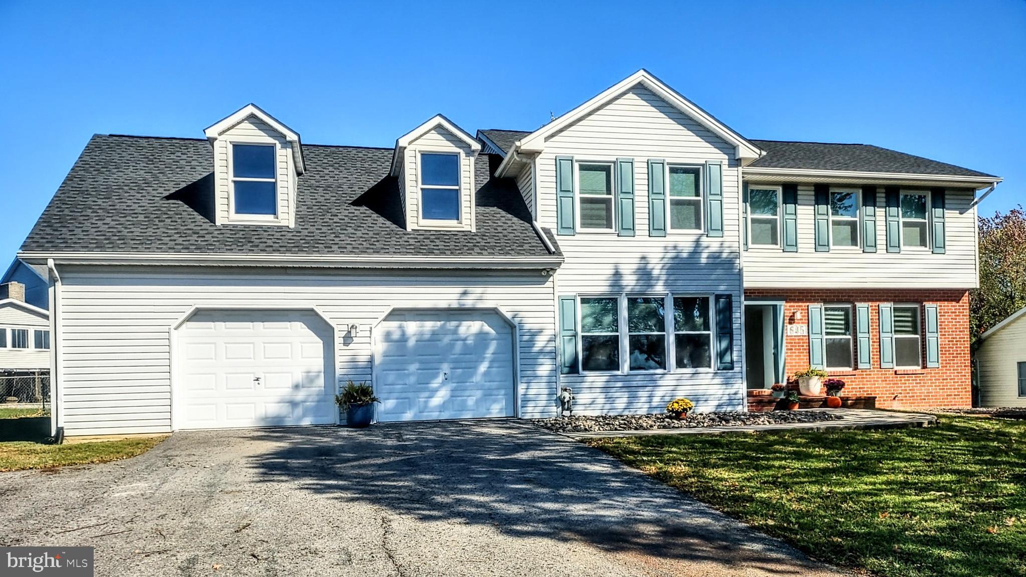 645 West 1st Street Boiling Springs, PA 17007 - Photo 2 of 23 a front view of a house with garden