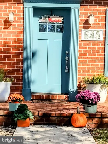 a backyard of a house with outdoor seating