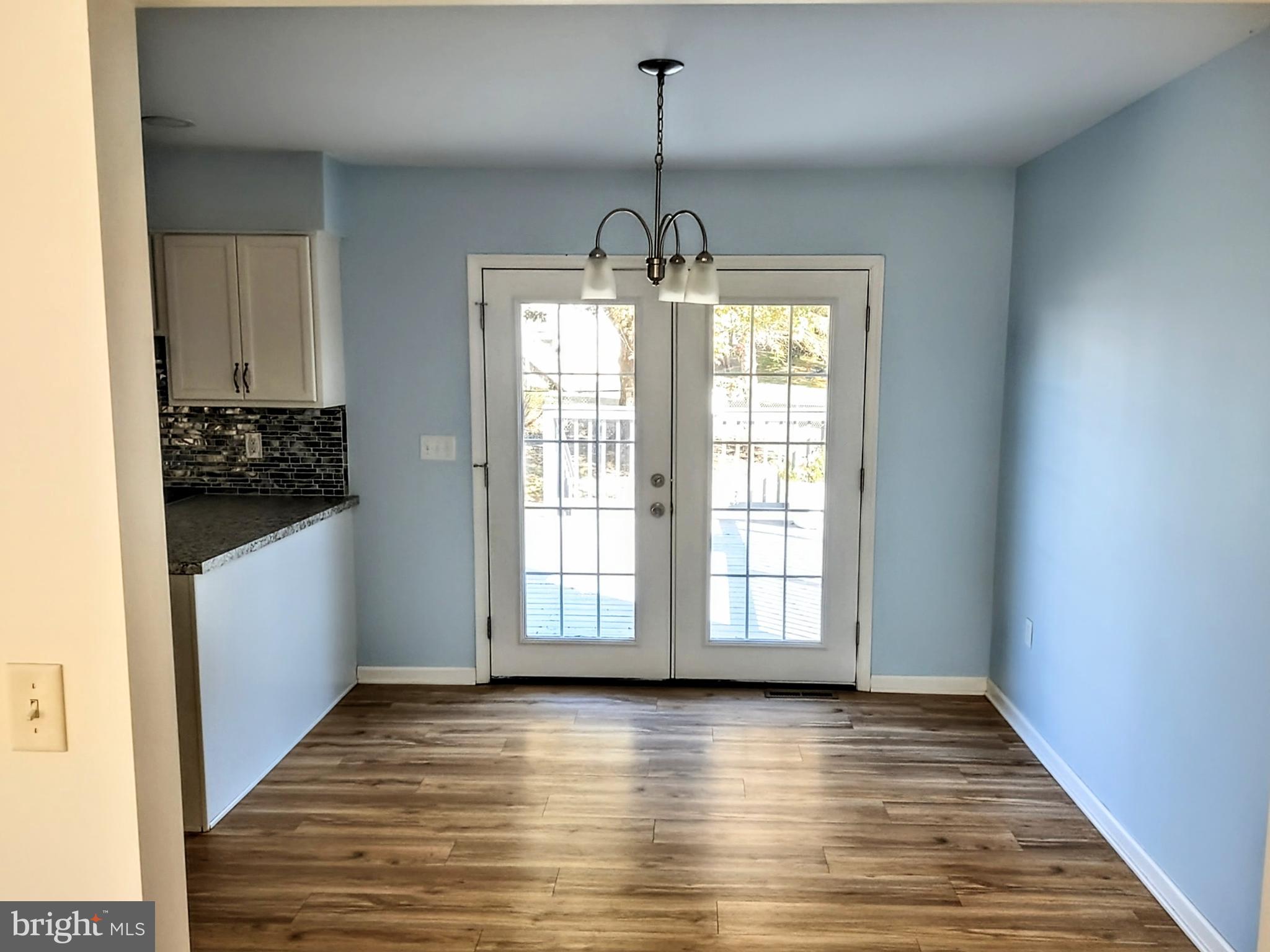 645 West 1st Street Boiling Springs, PA 17007 - Photo 8 of 23 a view of empty room with wooden floor and fan