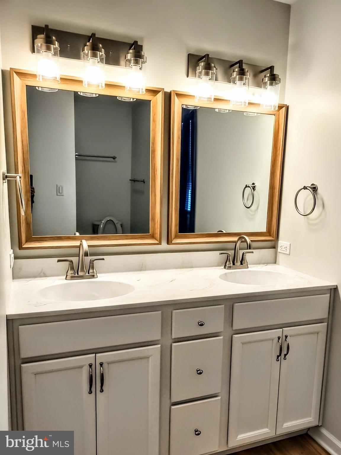 645 West 1st Street Boiling Springs, PA 17007 - Photo 10 of 23 a bathroom with a double vanity sink and mirror